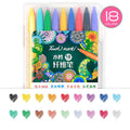 Set of Touch Mark water-based fibre pens in multiple colours with caps, arranged by a notepad.