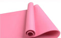 Red EVA yoga mat showing thickness, next to a blue mat, on a wooden floor.