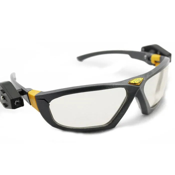 Yile anti impact goggles with LED lamp on a workbench showing protective eyewear and integrated light