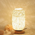 Hemp rope desk lamp with spherical shade on solid wood base