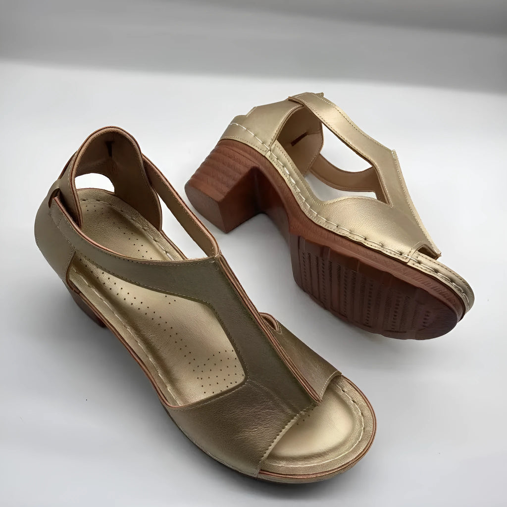 Plus size women's beige peep toe wedge sandals with a buckle strap and low heel.
