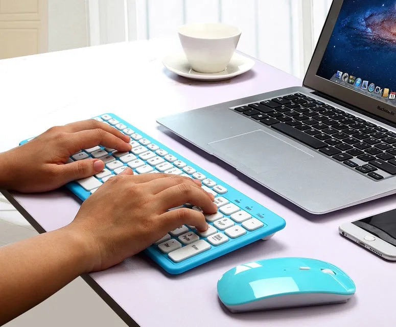 Wireless keyboard and mouse set in blue colour showing compact keyboard and mouse with USB receiver.