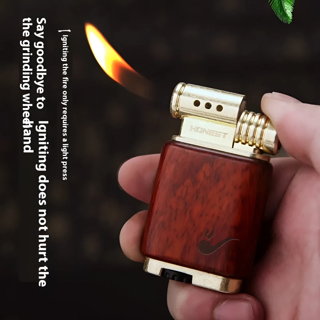 Decorative rosewood and blackwood gas lighter with sun face engraving on metal body.