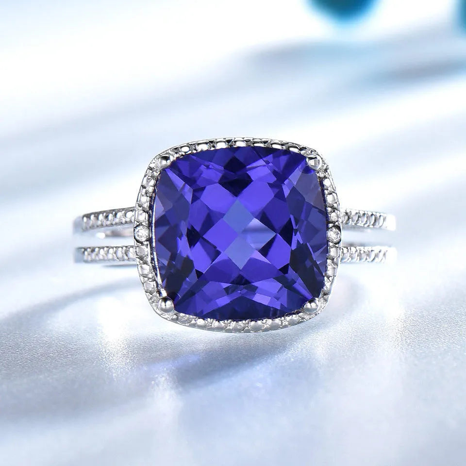 Women's sterling silver ring with a deep blue tanzanite gemstone.
