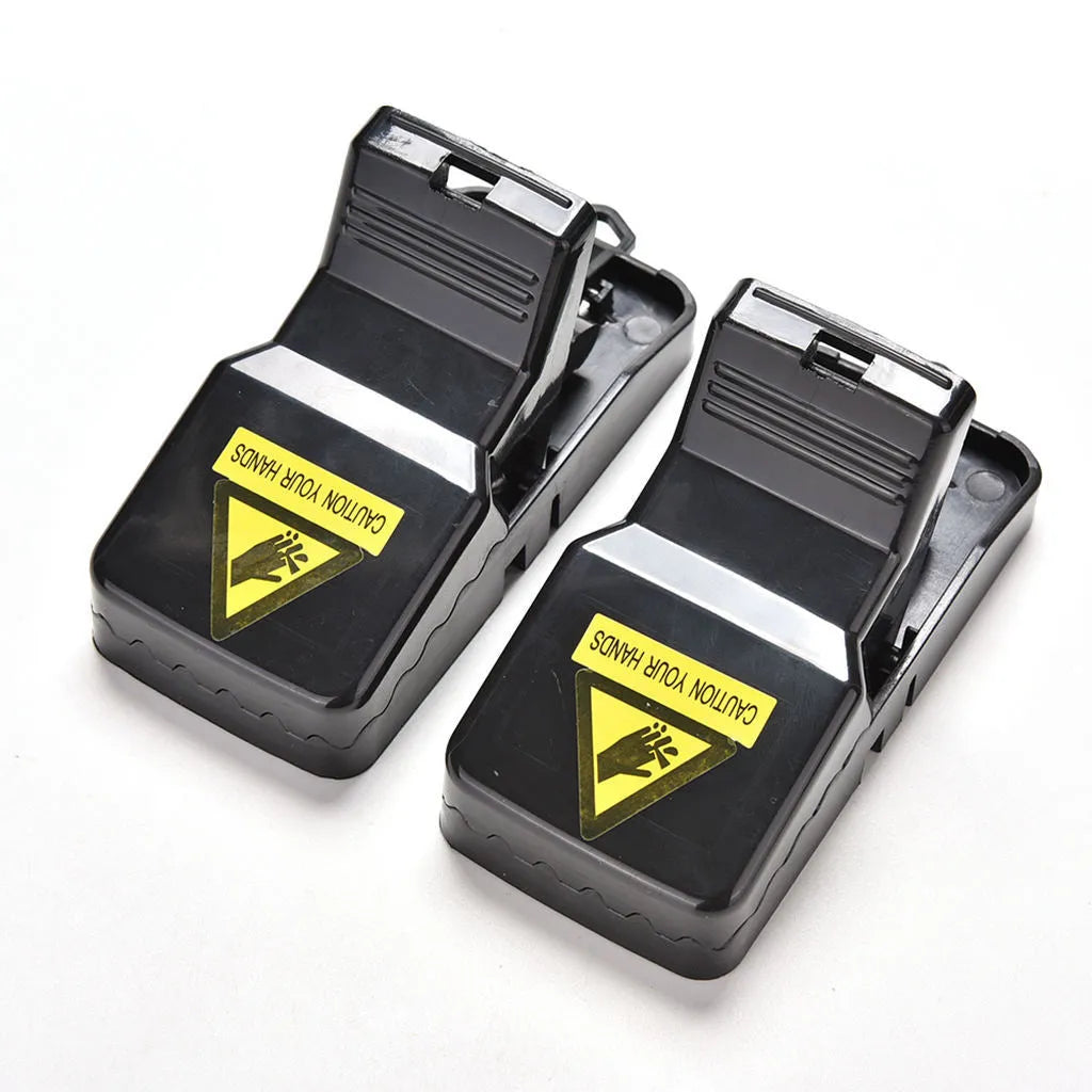 Six black snapping mousetraps showing PC+ABS plastic construction and bite-type mechanism