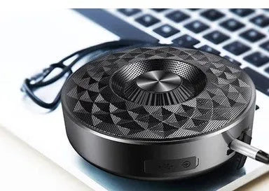 Compact portable Bluetooth speaker in black, orange, or silvery white with wireless audio and FM radio.