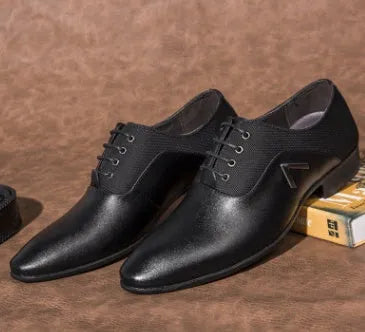 Men's black Oxford business casual shoe with a low-cut PU leather upper and rubber sole on a white background