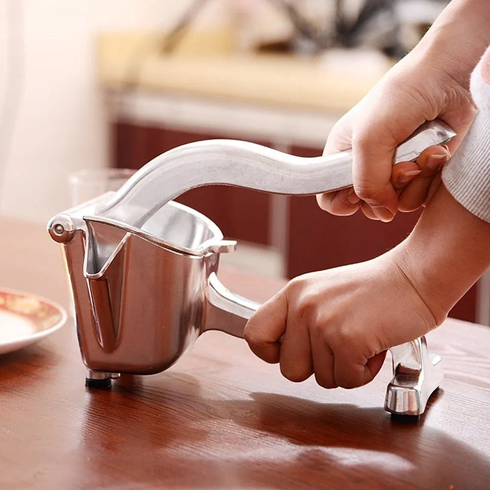 Silver heavy duty aluminium alloy lemon squeezer with large bowl on a counter