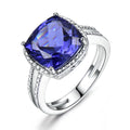 Women's sterling silver ring with a deep blue tanzanite gemstone.
