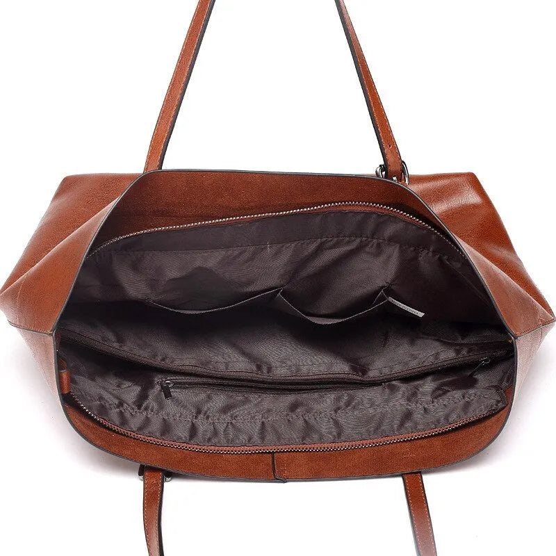 Brown waxed cowhide crossbody handbag showing front flap and adjustable strap against a neutral background.