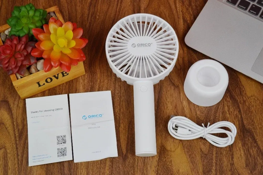 White ORICO FH1 portable USB rechargeable small fan on a desk