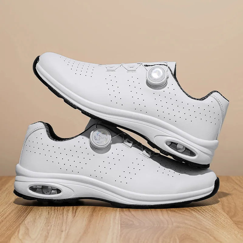 Black and white low-top men's tennis shoes with mesh upper and cross shoulder straps
