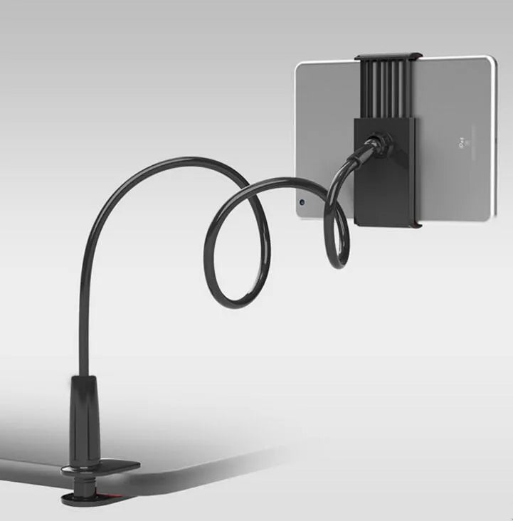 Black bedside oversize phone stand with a long adjustable arm on a wooden table.