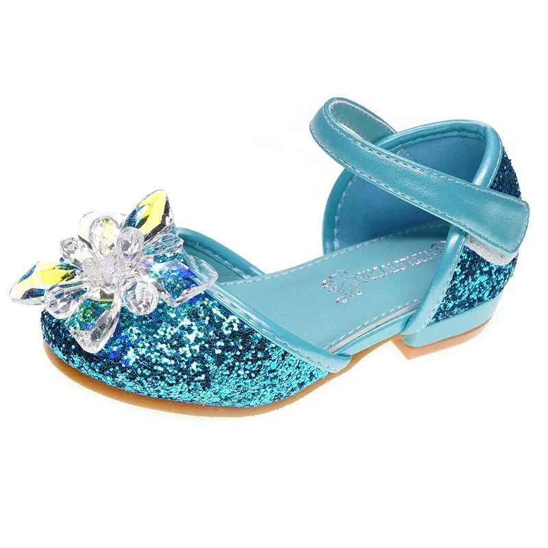 Girls crystal shoes with rhinestone decoration on shiny fabric upper, available in pink, blue, and silver