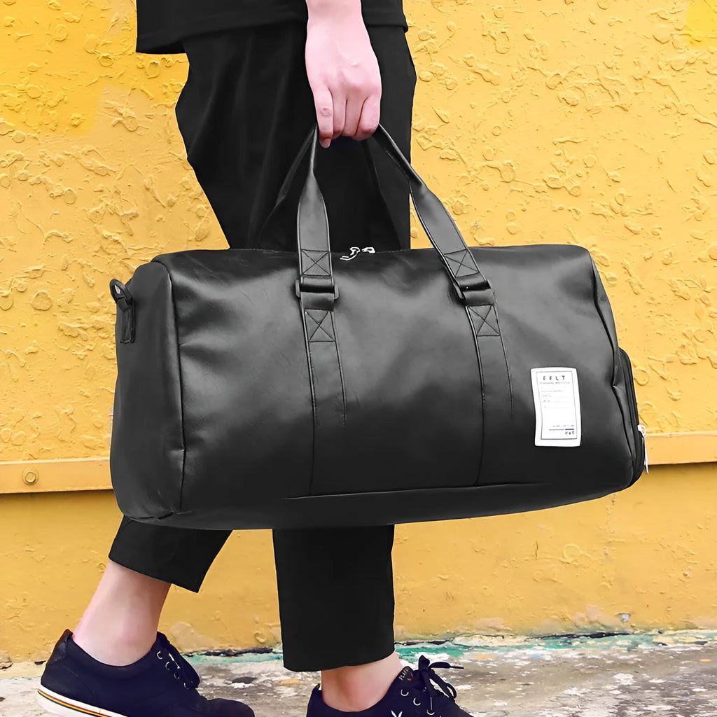 Black waterproof sports fitness bag with a separate shoe compartment and a diagonal carry strap.