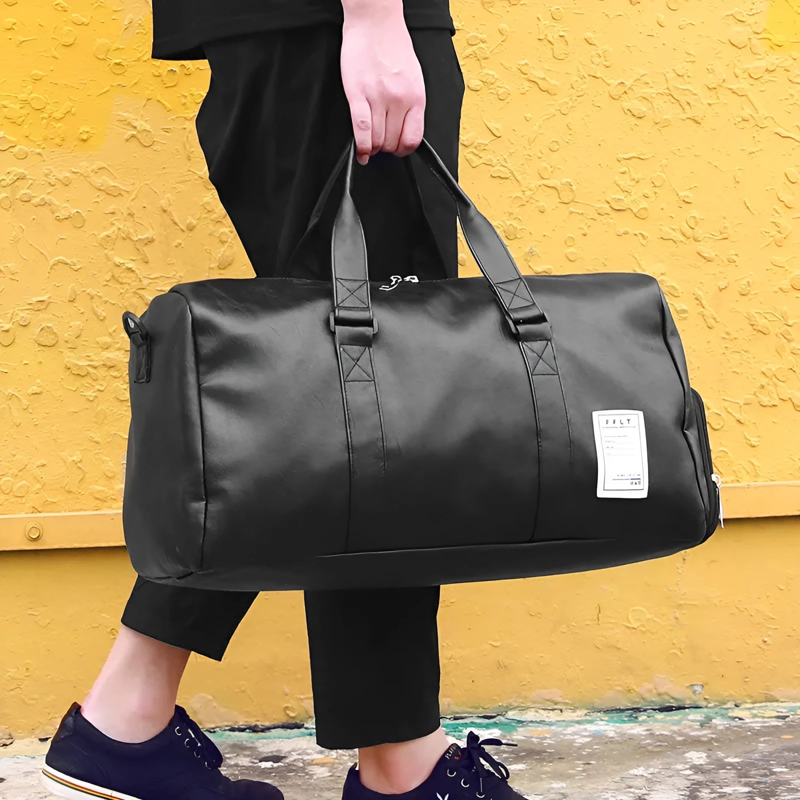 Black waterproof sports fitness bag with a separate shoe compartment and a diagonal carry strap.