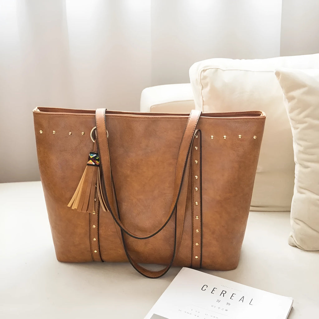 Women's shoulder crossbody tote bag in black with crossbody strap and open top
