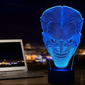 USB-powered 3D LED desk lamp showing multiple colour modes on an acrylic panel with a remote control.