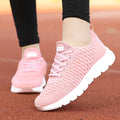 Women's running shoes in black, pink, or white with fly weave upper and durable outsole.
