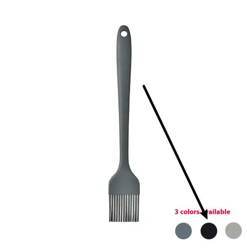 Silicone kitchen utensil set with twelve tools in a rotating white storage caddy on a counter.