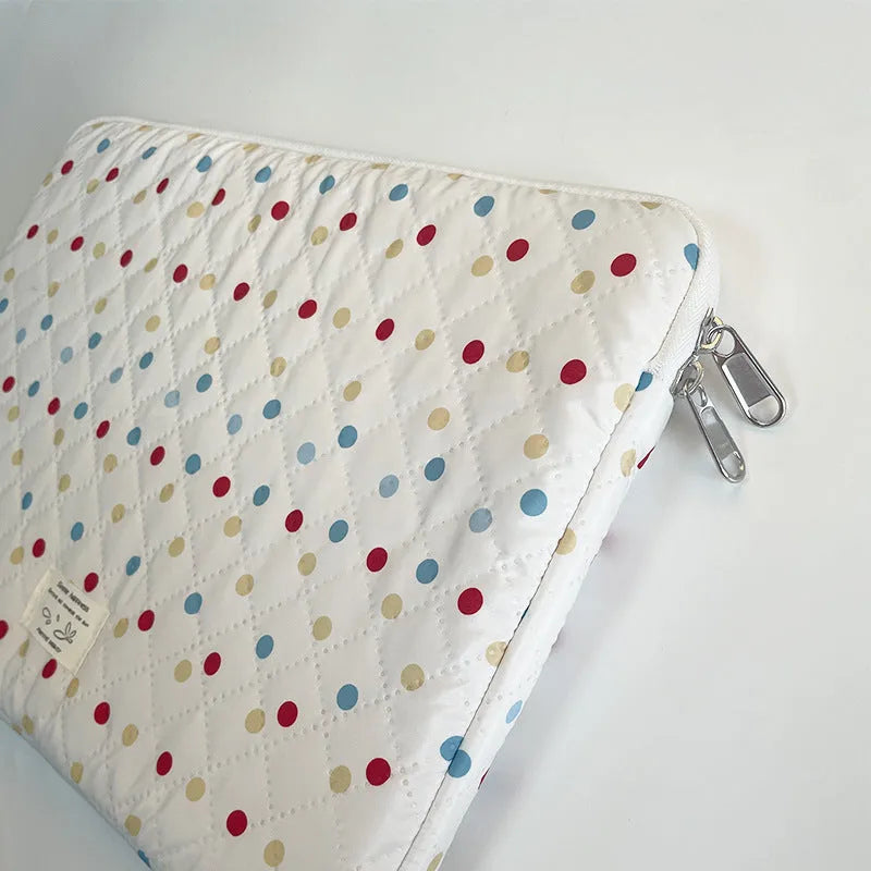 Women's polka dot laptop bag in polyester with breathable construction showing size options