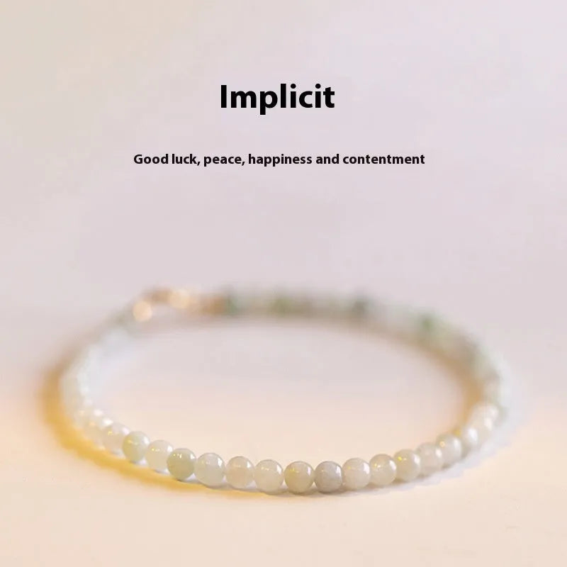 Women's Korean style retro jade ball bracelet on a wrist, showing the bead detail and chain clasp.