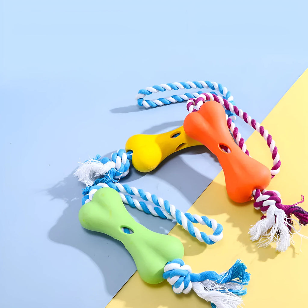 Green porous bone-shaped rope knot dog toy for chewing and holding treats.