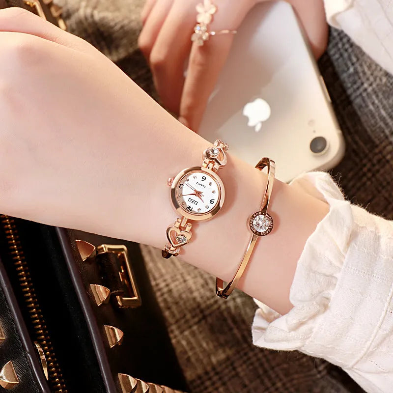 Women's simple rhinestone casual square watch with gold alloy strap and stainless steel buckle on white background