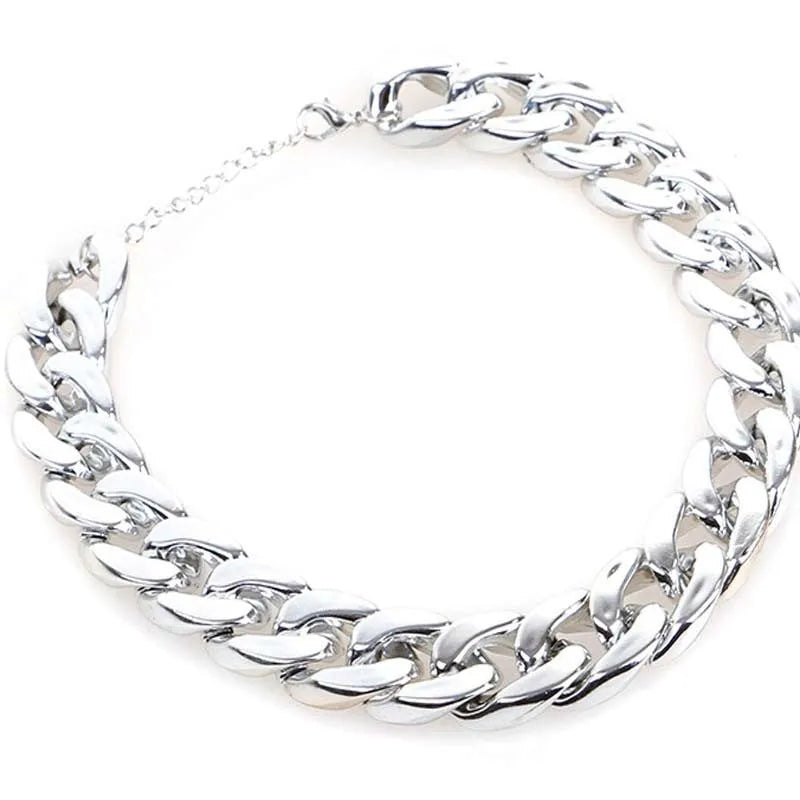 A gold chain-link style dog collar ornament on a white background.