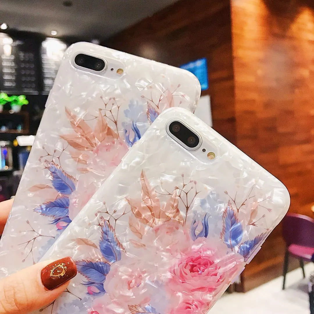 Soft TPU silicone iPhone case with a rose flower design on the back in brown, shown fitted to a phone.
