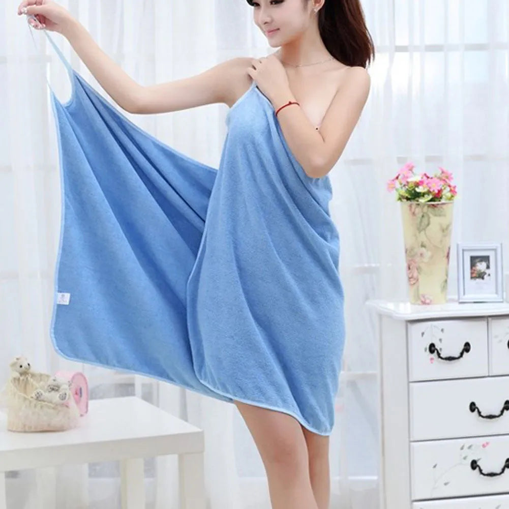 Long blue beach towel dress worn as a robe, showing its length and simple design.