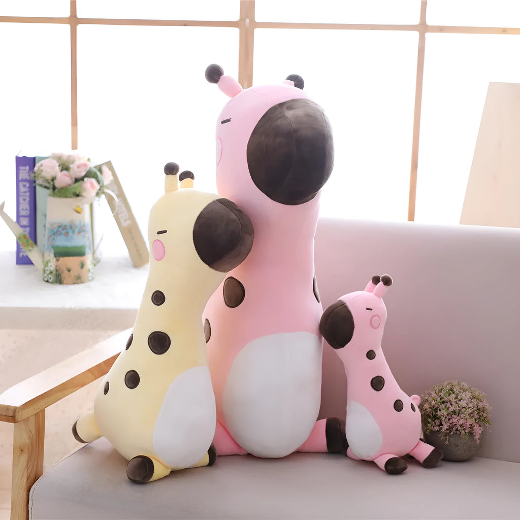Pink Sika Deer plush doll with short plush fabric, 30cm tall, on a bed