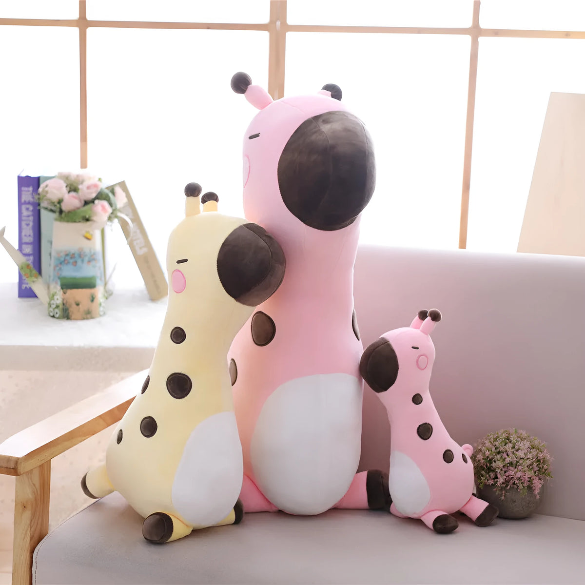Pink Sika Deer plush doll with short plush fabric, 30cm tall, on a bed