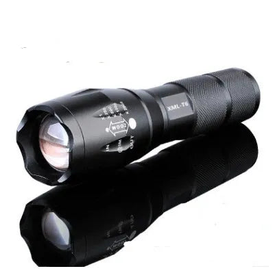 4000LM LED flashlight with aluminium alloy body and zoomable head, on a dark outdoor background