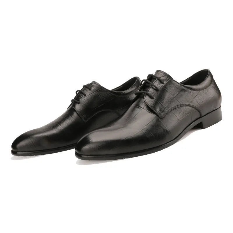 Men's black checkered leather derby shoes with a pointed toe and rubber sole.