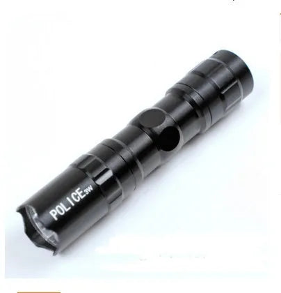 Black aluminium mini LED flashlight on a dark background.