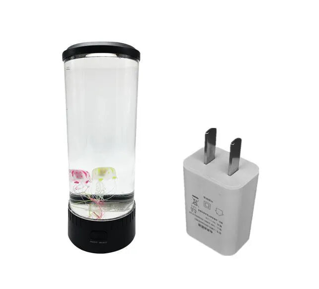 Black jellyfish LED light with acrylic shade on a desk, 35cm tall, USB powered