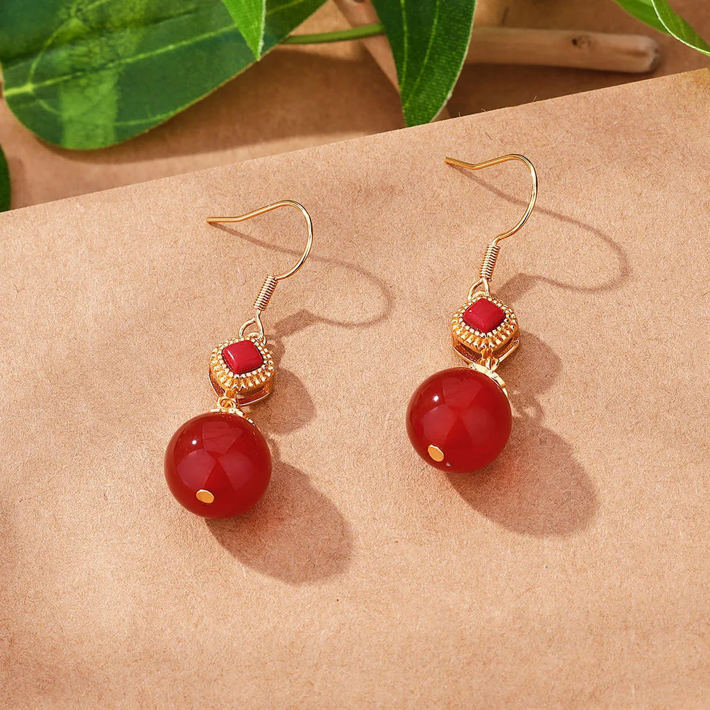 Geometric copper alloy earrings with round red agate beads and S925 silver jasper inlay.