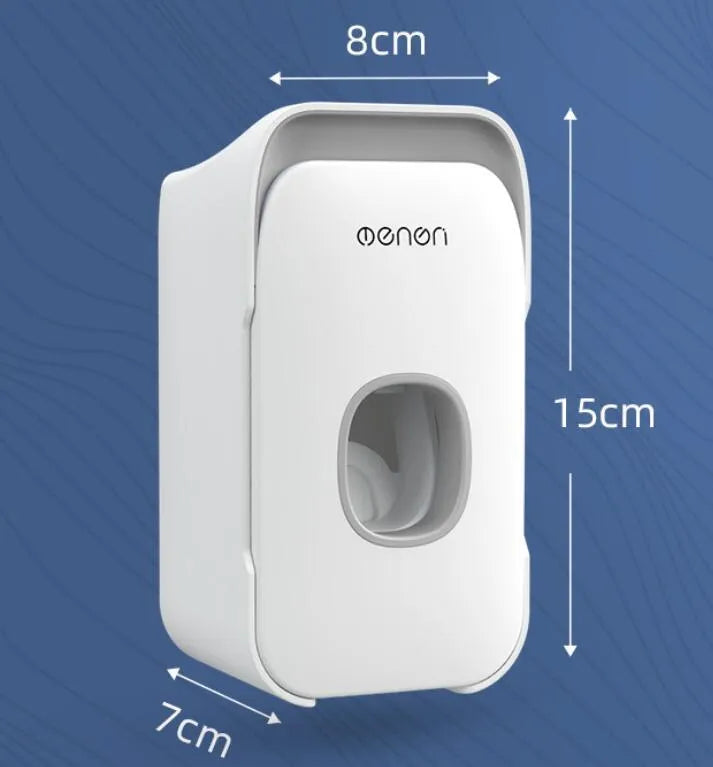 Blue automatic wall-mounted toothpaste dispenser with a sensor for touchless operation on a bathroom wall.