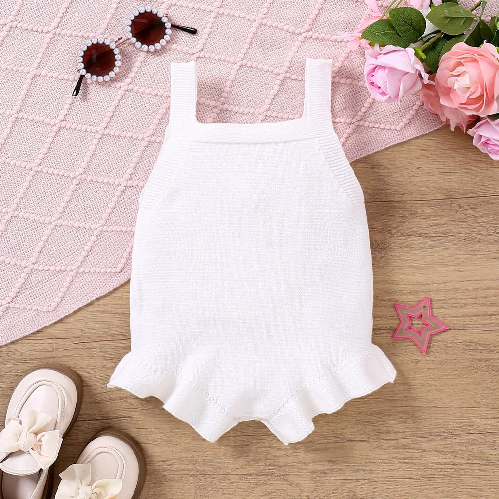 Baby girl sling romper in white with bow embroidery on wool blend fabric.