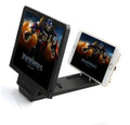 Black 3D mobile phone screen amplifier on a magnetic stand holding a phone.