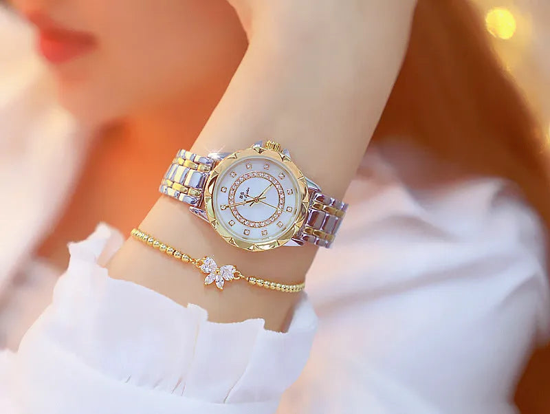 Women's quartz watch with 32mm round dial, alloy case, and mineral glass in a choice of gold or silver finishes
