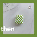 Black and green checkerboard pattern TPU protective case sleeves for Apple AirPods, one with a smiley face lanyard attached.