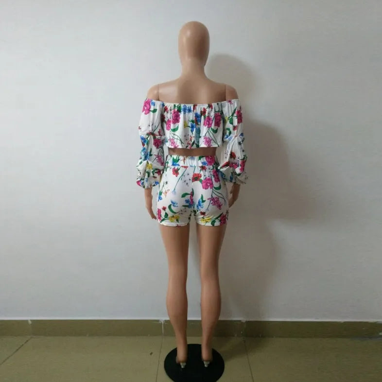 Women's multicolour digital print two-piece suit with a pile sleeve jacket and matching shorts.