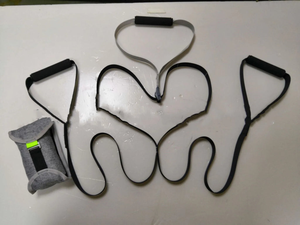 Black suspension training belt resistance band with nylon webbing strap and metal climbing hook