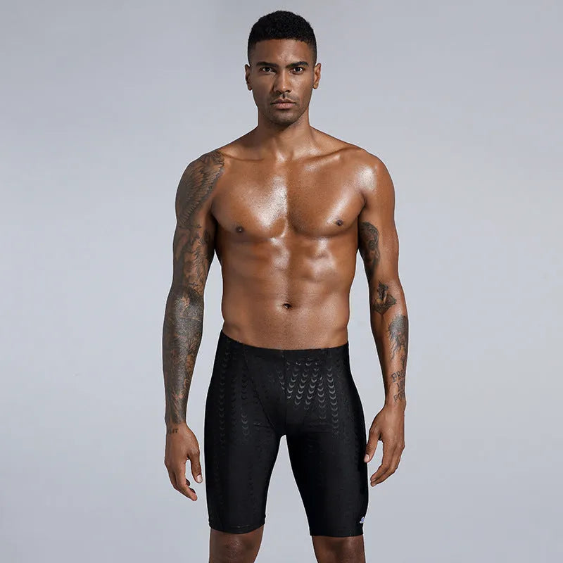 Men's solid colour polyester swimming trunks shown in boxers and cropped pants styles.