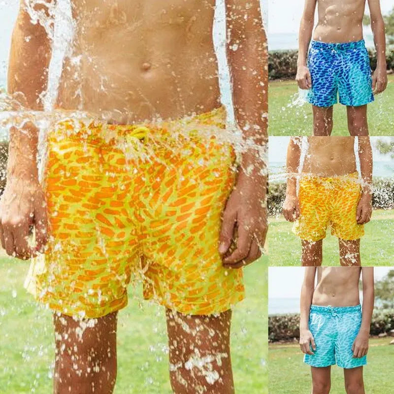Thermochromic children's polyester shorts in solid blue colour changing to green when warm