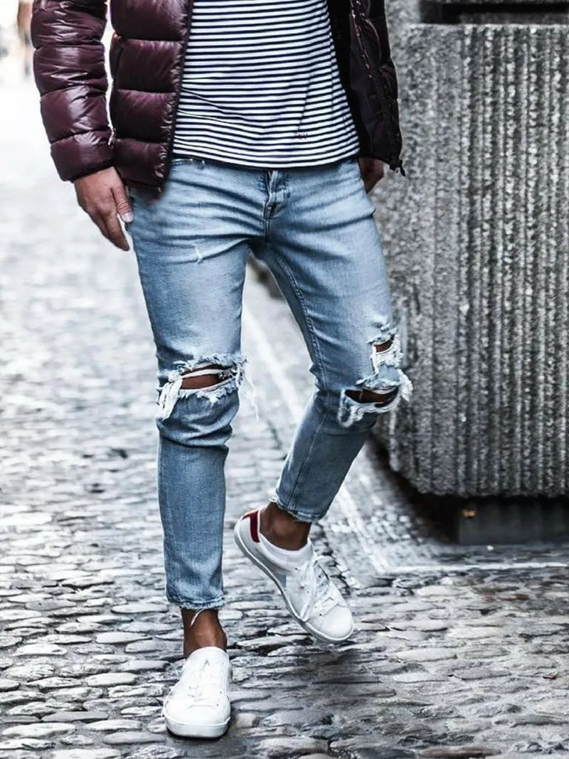 Men's light blue straight-leg distressed jeans with embroidery and washed finish, five-point length, mid-rise zip closure