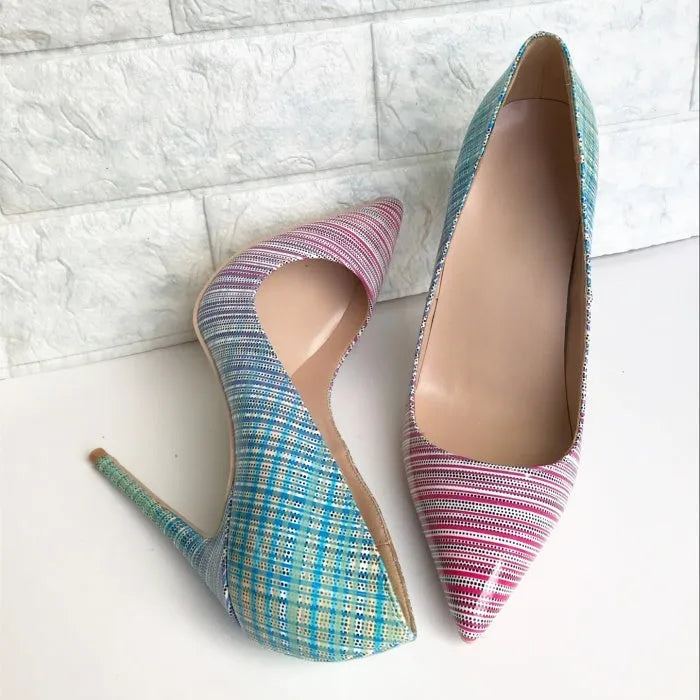 Pink and blue gradient patent leather ladies high heels with a pointed toe on a rubber sole.