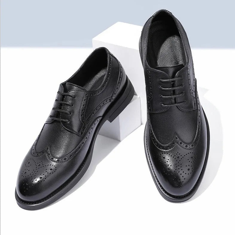 Men's classic brown brogue leather business shoes on a white background.